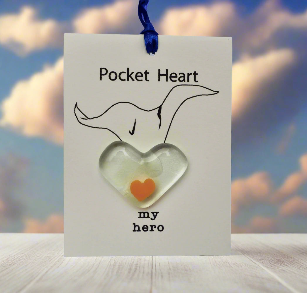 Heart-shaped object with 'my hero' text on a card with a fox illustration