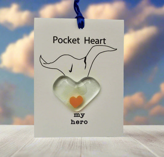 Heart-shaped object with 'my hero' text on a card with a fox illustration
